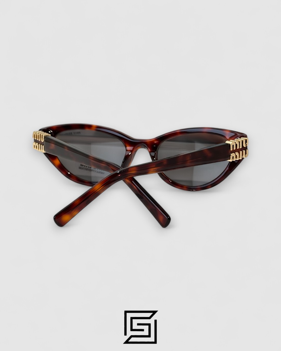 ⁦Miu Miu MUA04 21C40 Light Grey Lenses and Tiger Brown Frame With Gold Logo⁩ - الصورة ⁦6⁩