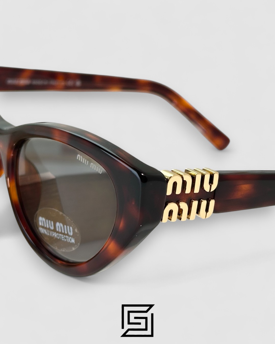 ⁦Miu Miu MUA04 21C40 Light Grey Lenses and Tiger Brown Frame With Gold Logo⁩ - الصورة ⁦4⁩