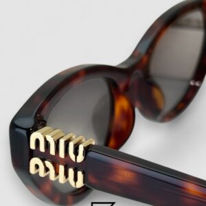 ⁦Miu Miu MUA04 21C40 Light Grey Lenses and Tiger Brown Frame With Gold Logo⁩ - الصورة ⁦2⁩