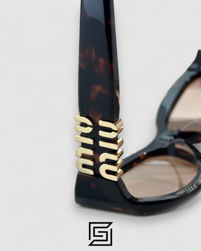 Miu Miu MU14 141-90H Light Brown Lenses and Tiger Brown Frame With Gold Logo
